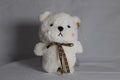 Peluche de oso blanco con lazo